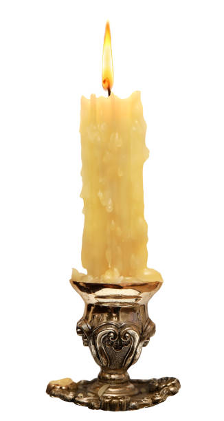 istock burning old candle vintage bronze Silver candlestick. Isolated On White 640046086