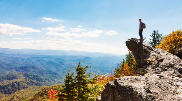 istock Man walking on the edge of a cliff 640047030