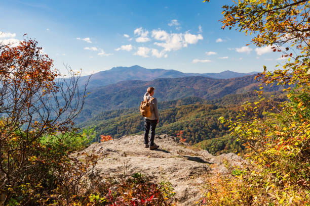 istock Man walking on the edge of a cliff 640047128