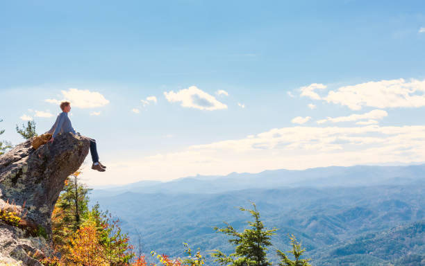 istock Man at the edge of a cliff 640047130