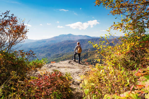 istock Man walking on the edge of a cliff 640047288