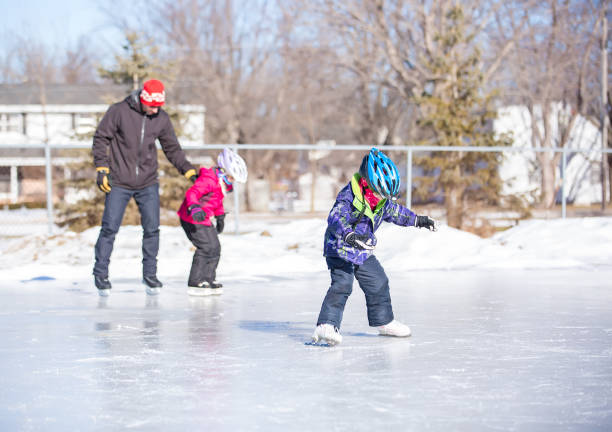 istock Girls First Time Ice Skating With Dad 640053284