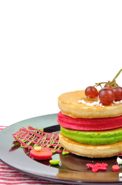 Stacking Colorful pancake on cycle plate with honey glass.