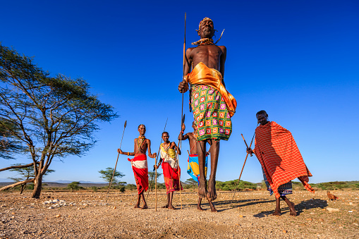 African warrior from Samburu tribe performing a traditional jumping dance, central Kenya. Samburu tribe is one of the biggest tribes of north-central Kenya, and they are related to the Maasai.