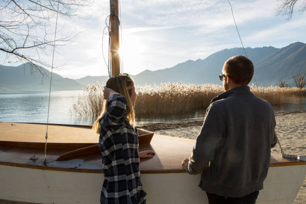 istock Young couple by the lake relaxing in nature 640057230