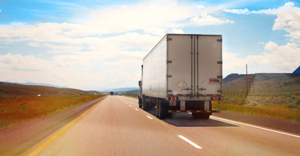 istock White Semi Truck on the road 640060626