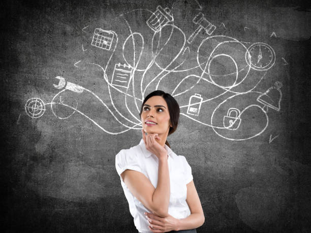 istock Businesswoman in front of blackboard 640063236