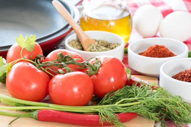 istock Frying Pan with Fresh Vegetables On Wooden Table 640063368