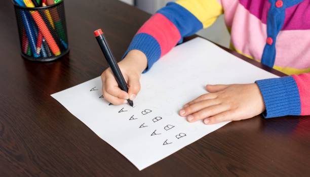 istock Little Girl Writing Letters 640063574