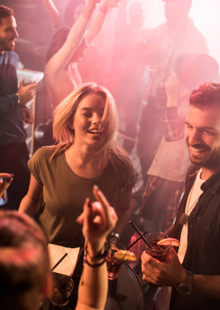 istock High angle view of cheerful young people disco dancing. 640064354