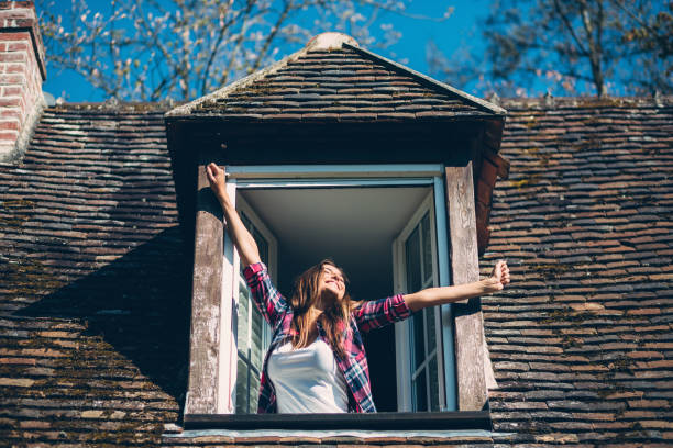 istock Smiling woman on the rooftop window 640064514