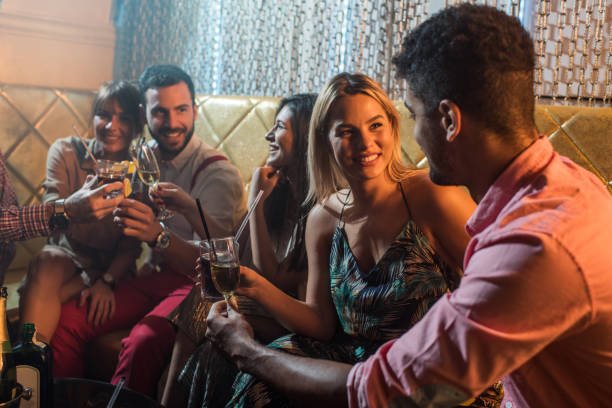 istock Young people in bar toasting and enjoying the night out. 640066404