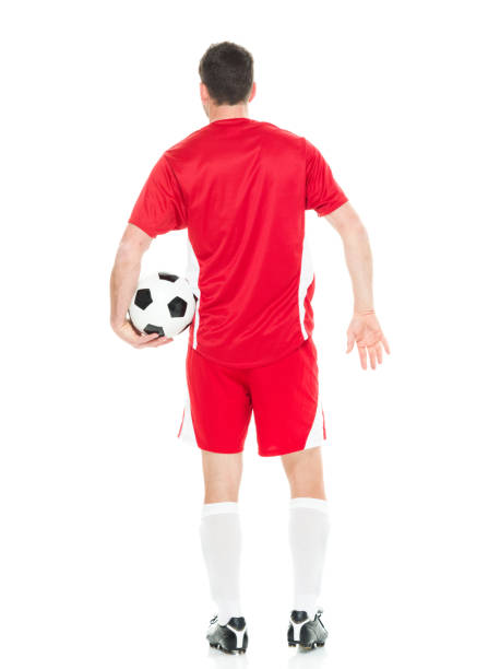 istock Rear view of soccer player holding ball 640066852