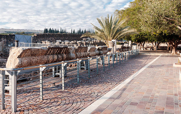 Capernaum, Israel - January 01, 2017 : Remains of walls, columns and ornaments from the White Synagogue exposed for all to see in Capernaum (Cafarnaum), near Tiberias, Israel