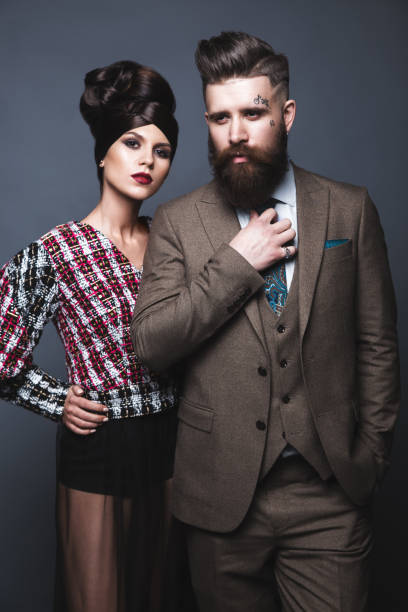 istock Couple, man and woman in evening dresses posing for studio 640069220