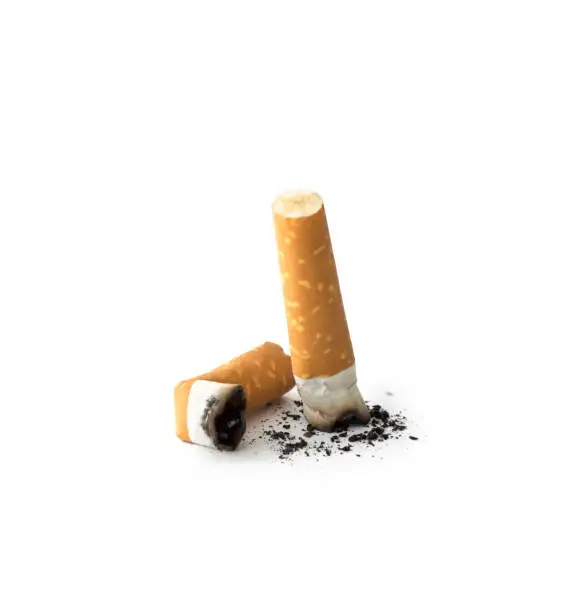 Cigarette butts with ash , isolated on white