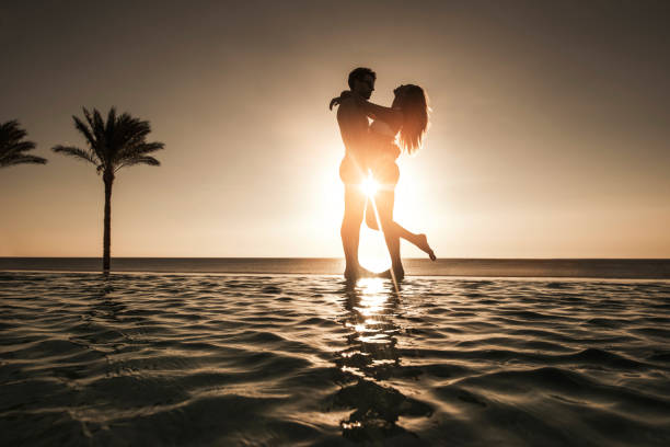 istock Romantic couple at the edge of an infinity pool. 640069262