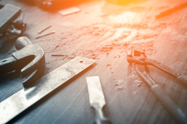 wood workshop with handcraft tools and raw wood on construction site