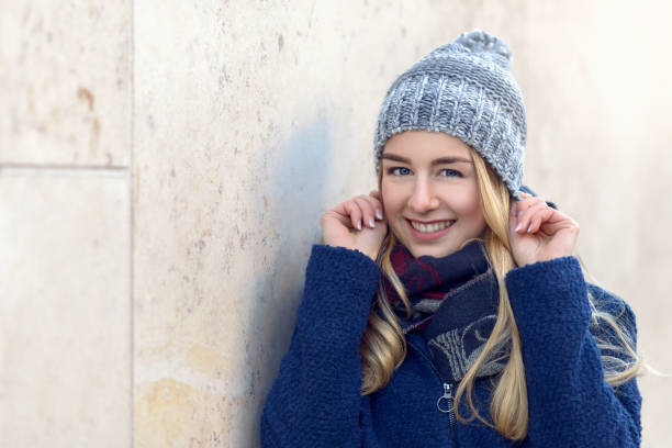 istock Smiling pretty young woman in a beanie 640070946