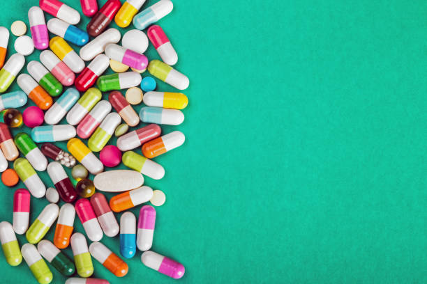 assorted pills and capsules pharmaceutical medicine stock photo