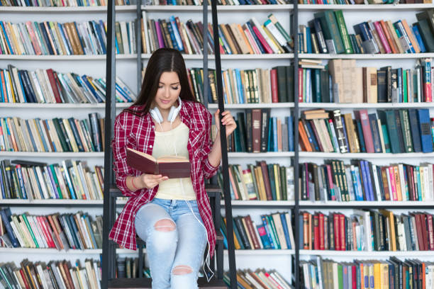 istock Teenager in library 640075966