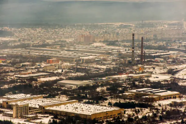 citycenter and factories in winter snow at lviv lvov ukraine - aerial view