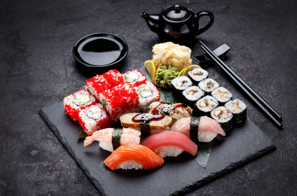 istock Sushi set on a stone plate and concrete background. 640076674