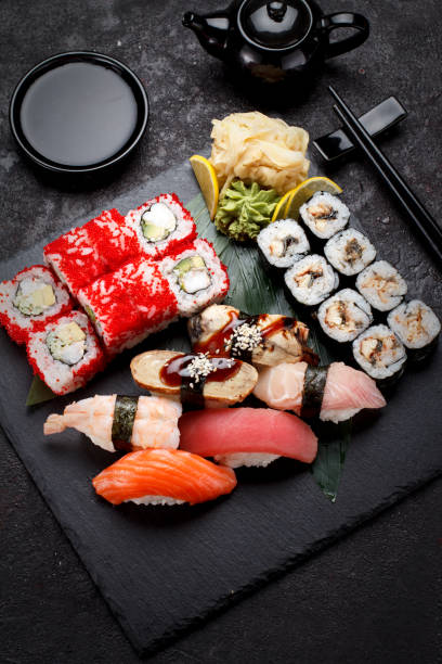 istock Sushi set on a stone plate and concrete background. 640076860