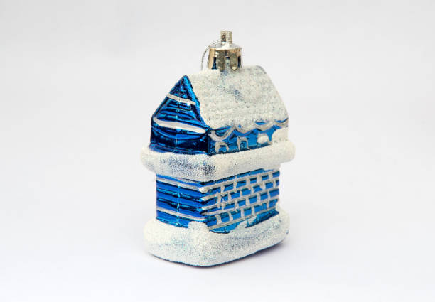 Christmas toy for the Christmas tree and new year, beautiful blue house isolated on the white background.