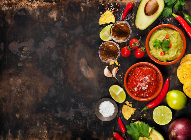 istock Green Homemade Guacamole with Tortilla Chips, Salsa and tequila 640081592