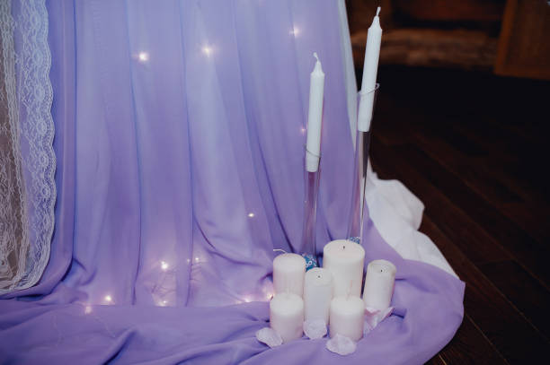 istock White candles near the table. Wedding decorations 640082548