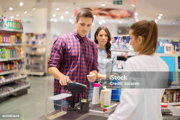 Entering Pin In Supermarket Stock Photo - Download Image Now - Supermarket, Cash Register, Paying