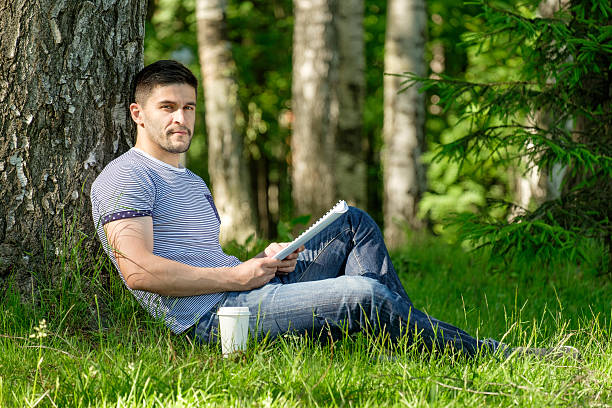 istock Young man in city park 640083730