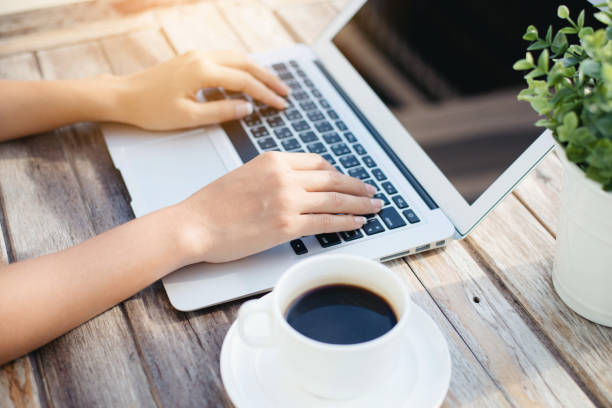 istock Woman hand using laptop computer on wooden table 640083914