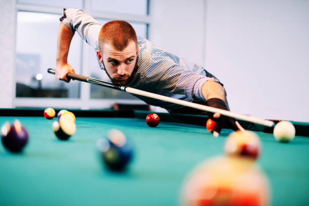 istock Portrait of billiard player aiming during tournament 640085138