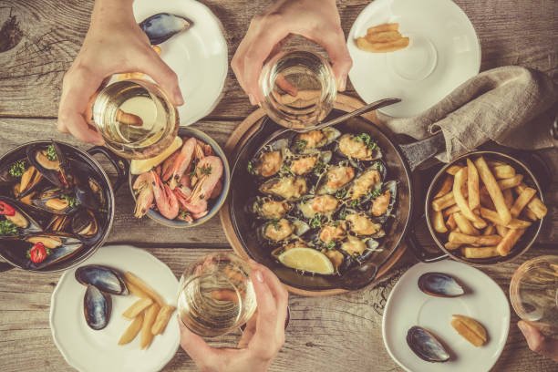 istock Family having summer lunch with seafood 640086320