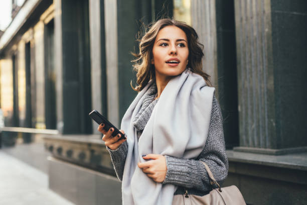 istock Woman texting outdoors 640086672