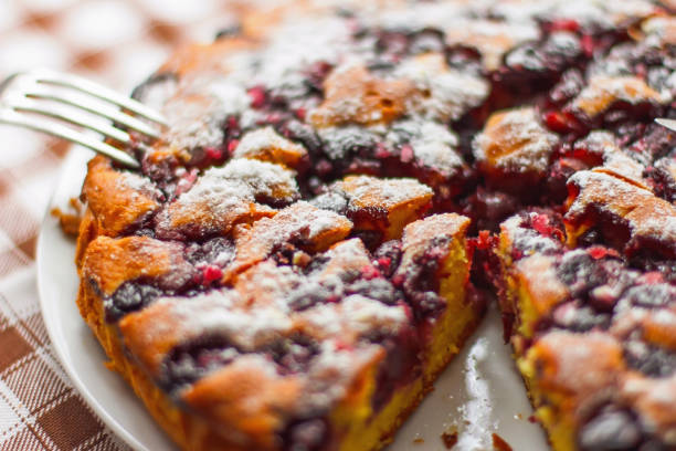 istock cutting fresh homemade delicious cake with cherries 640086736