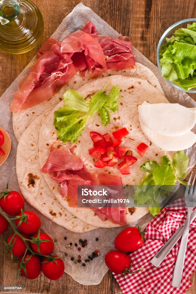 Piadina with ham and lettuce. Emilia-Romagna Stock Photo