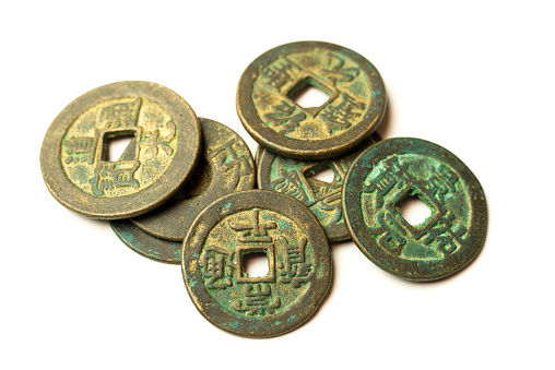 Ancient bronze coins of China on over white