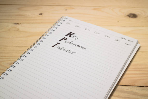 istock KPI on notebook with pen / wood background 640091158