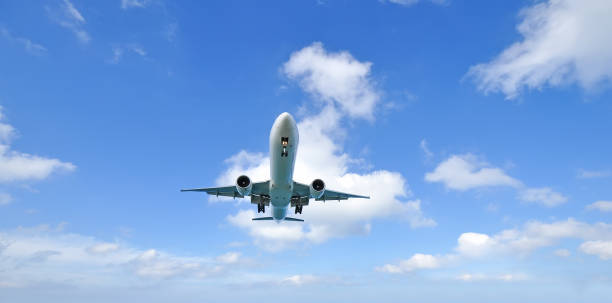 istock airplane landing over the sea 640092198