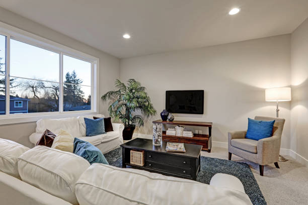 istock White and beige living room interior with blue accent rug 640093300