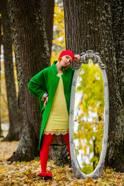 istock Girl in the autumn forest 640093928
