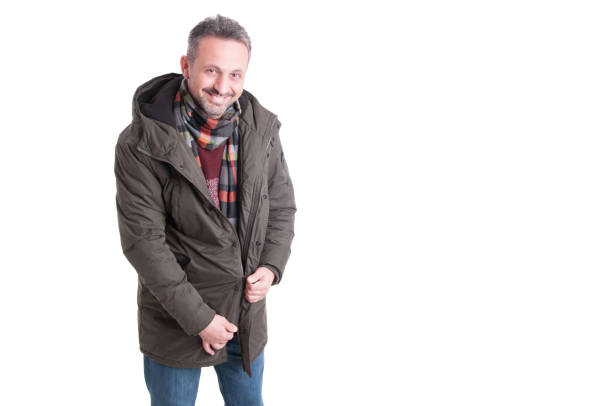 istock Man smiling and zipping his winter jacket 640094876