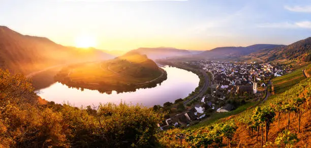 Sunrise at the moselle river bend over the village Bremm