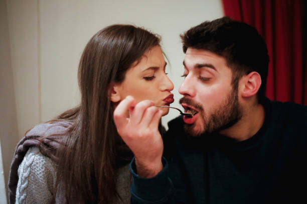 istock Cute loving couple having fun together in cafe 640096380