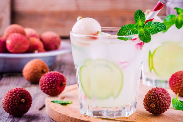 Cold fresh lemonade with lychee, lime and mint in glass