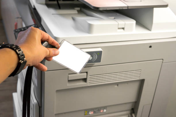 man hold card for scanning key card to access  photocopier - print computer printer printout push button imagens e fotografias de stock