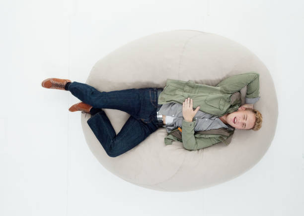 istock Above view of man lying on bean bag 640098664